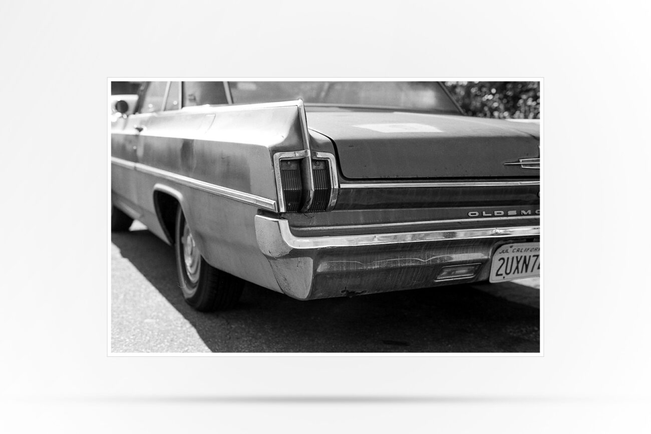 Black and White Photograph of a vintage Oldsmobile